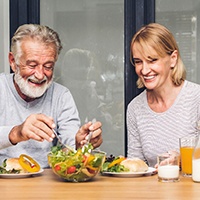 An older couple eating a healthy breakfast together