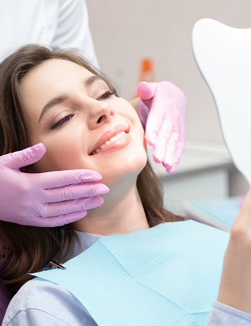A woman smiling during a dental appointment