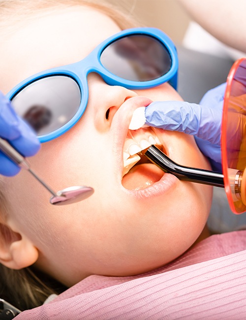 Child receiving dental sealants