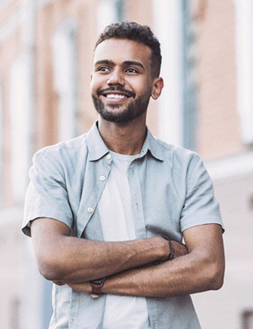 man smiling with dental crowns in Temple