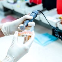 Lab technician working on dentures