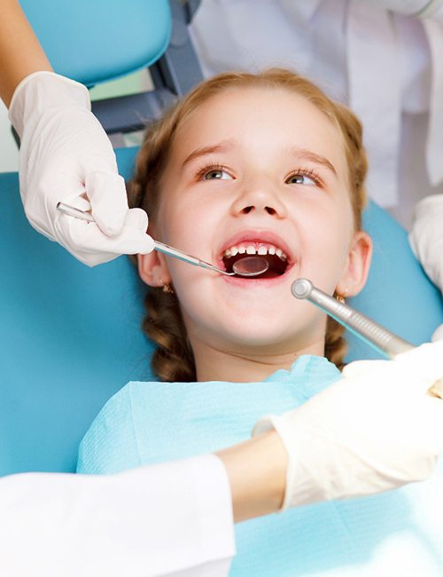 young girl smiling visiting dentist in Temple
