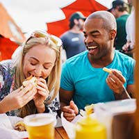 Two friends eating healthy to prevent dental emergencies in Temple