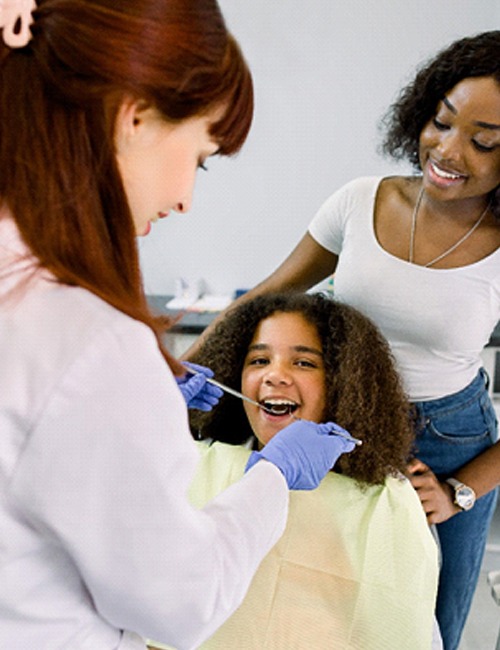 Mother and daughter visiting an emergency dentist in Temple