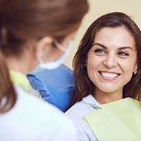 a patient smiling during a dental checkup in Temple