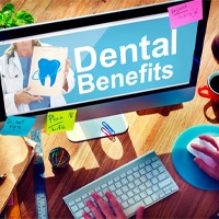 a person searching their dental benefits on a computer