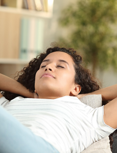 Woman resting on couch