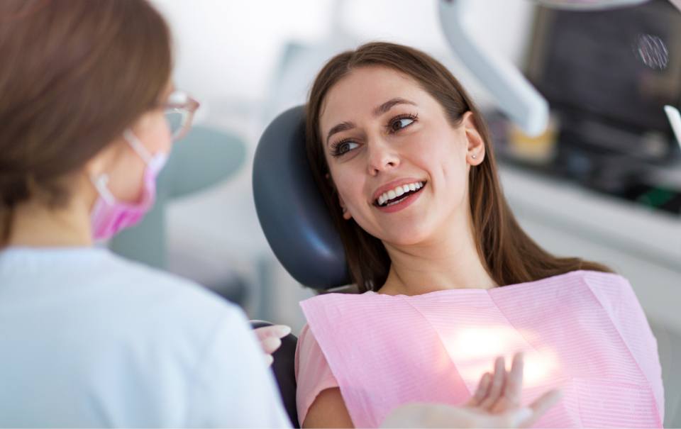  Smiling woman in dental chair