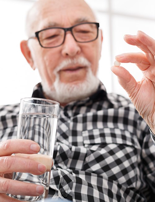 Patient taking oral conscious dental sedation pill