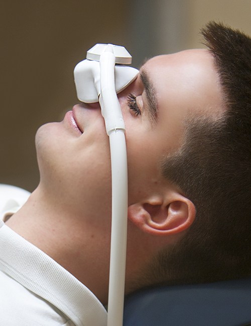 Man with nitrous oxide dental sedation mask