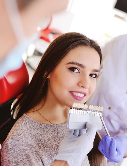 Woman smiling while getting veneers in Temple