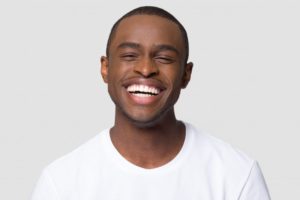 a man with a bright beautiful smile from cosmetic dental treatments
